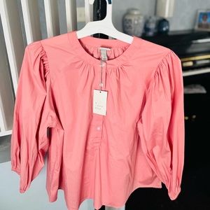 This Pink Top has never been worn! The brand is “A New Day” by Target.